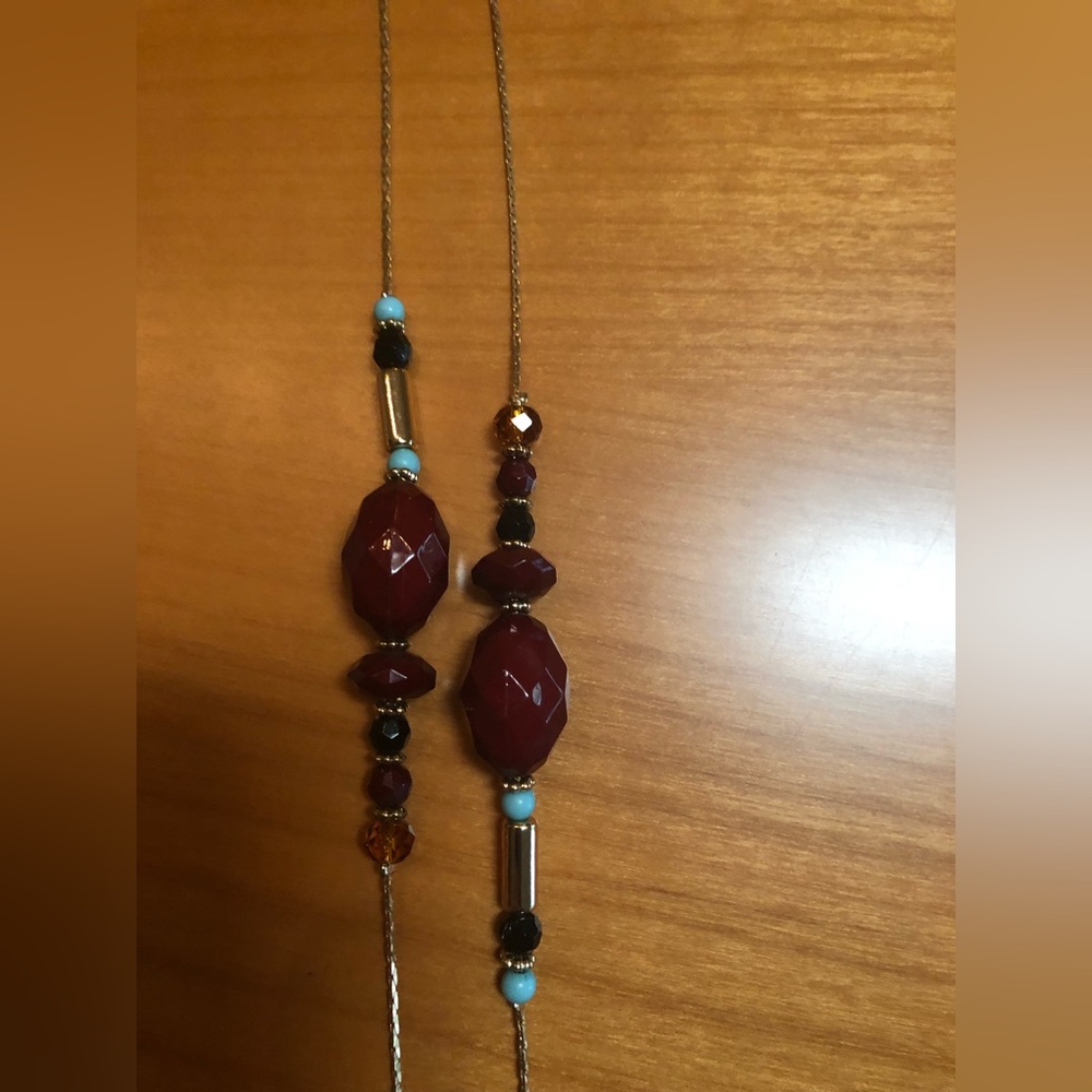 Chico’s burgundy blue gold necklace.